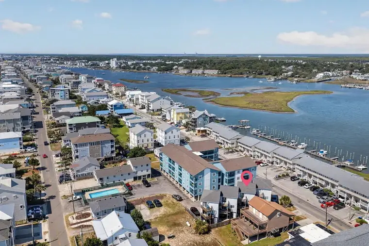 Aerial of the canal, docks and boats behind Canal Drive