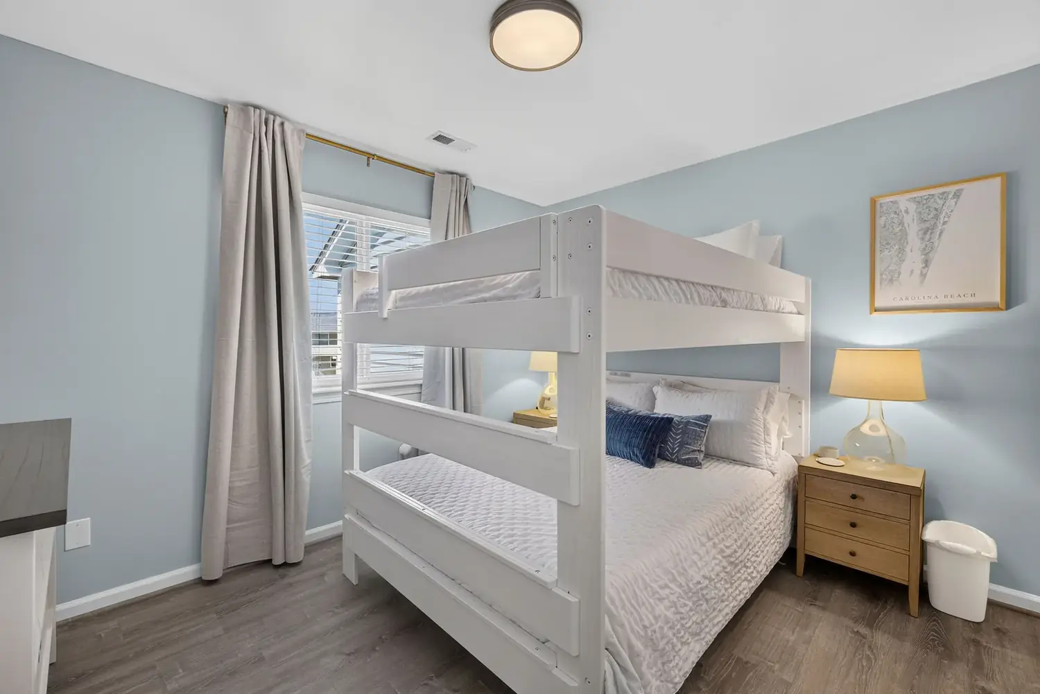 Bunk room with a queen bed and a full-over-full bunk bed
