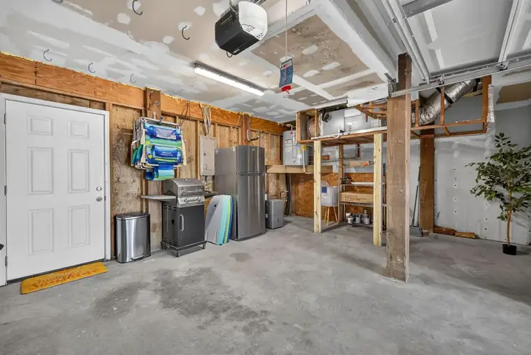 Garage interior with extra refrigerator and storage