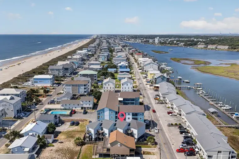 Aerial view of Carolina Beach showing the ocean, Canal Drive, and the marina